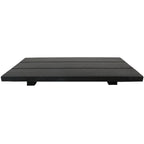 A rectangular black composite deck mat made of five horizontal slats, shown from a low angle against a plain white background.