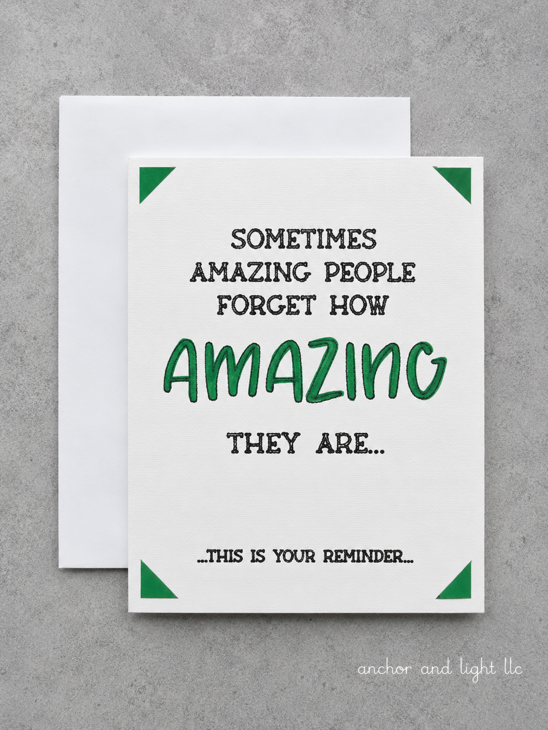 A square white greeting card with green corner accents and black-and-green text reading, 'SOMETIMES AMAZING PEOPLE FORGET HOW AMAZING THEY ARE.